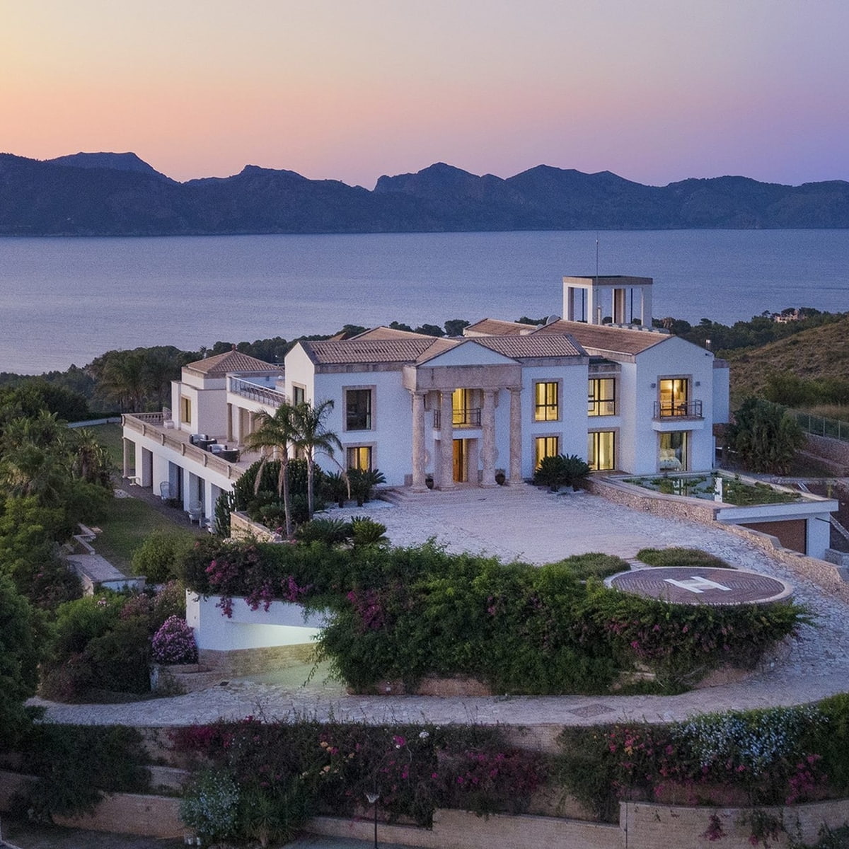 Sundown over exceptional luxury villa in Mallorca with sea views private pool helipad spa gym